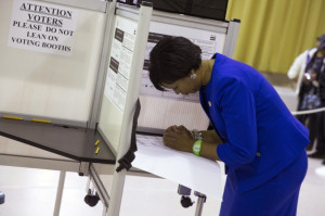 candidate Muriel Bowser, right, fills out her ballot on election day ...