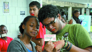 UWI students in day of silence against bullying