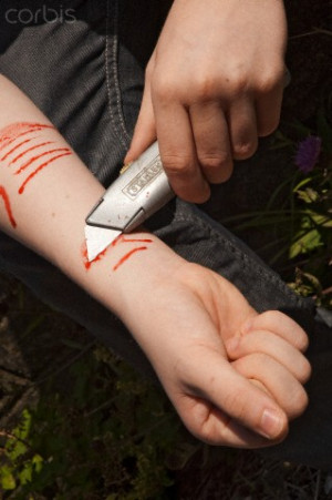 Boy cutting wrist