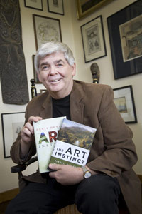 Professor Denis Dutton with copies of his new book The Art Instinct