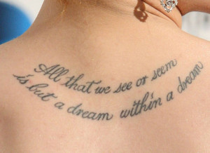 The tattoo between Evan Rachel Wood's shoulder blades is a quote by ...