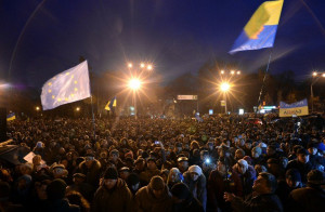 ANGER IN KIEV. Ukrainian protesters wave an EU flag as hundreds gather ...