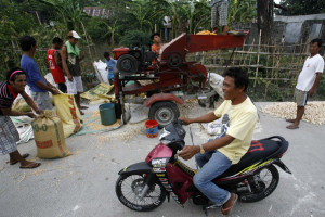 Erly Famadula rides a motorbike, bought from the remittances sent by ...