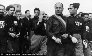 Benito Mussolini is shown with members of the Blackshirt Legion during ...