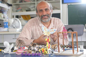 Arvind Gupta with the toys he creates