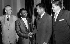 Jr., second from left, shakes hands with Vice President Richard Nixon ...