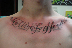 No Time For Heroes Tattoo On Man Chest