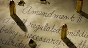 Second amendment with bullets casting shadows onto the document