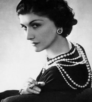 Coco Chanel in black dress with strands of pearls - fashion quotes by ...