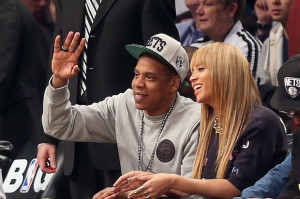 Jay-Z and Beyonce watch the Nets / Photo by Getty