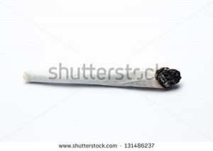 Burning joint of marijuana on white background - stock photo