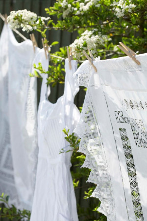 love a clothes line...but love the white linens and garments even more ...