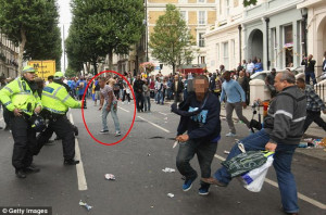 Scene of horror: Rio Andre, 20, circled, has blood pouring from his ...