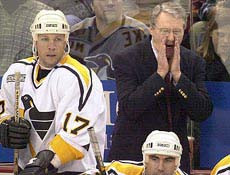 Herb Brooks yells to Penguins players on Dec. 11, 1999, during his ...