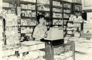 Aunty Polly at the counter of Universal Pharmacy