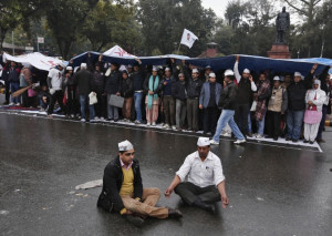 Supporters of the Aam Aadmi Party take part in a sit-in protest as ...