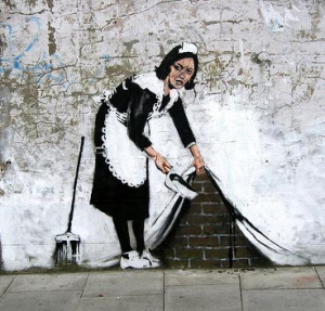 Banksy Graffiti, Woman Sweeping Under Wall