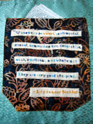 ... which bears a cross stitched quote by the artist Lily van der Stokker