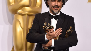 Alejandro Gonzalez Inarritu poses in the press room with his awards ...