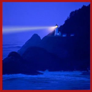 Lighthouse beams across stormy night sea