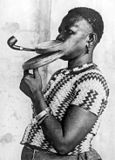 Extended mouthpiece for pipe smoking woman, who is performing in a ...