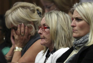 June Steenkamp (centre), mother of Reeva Steenkamp, watches with ...