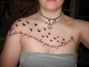 Flying Birds And Quote Tattoo On Girl Chest