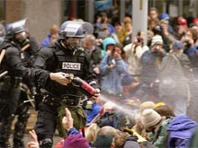 ... WTO protests in Seattle, police use pepper spray against protesters