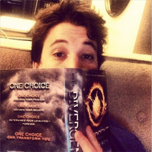 Miles Teller reading Divergent:)