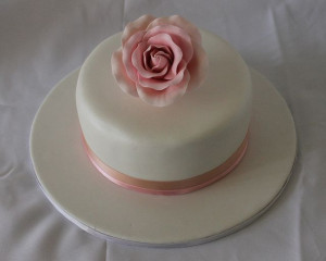 Like this cake. Simple. Maybe not a flower on top though...