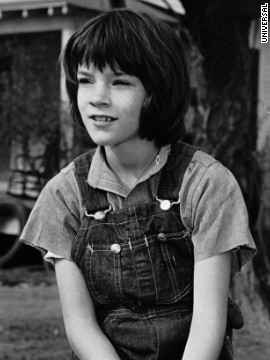 Mary Badham as Scout Finch.