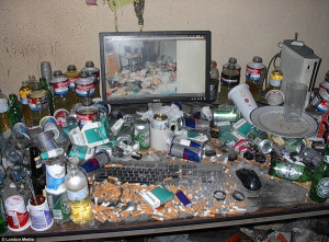 ... of filthy home offices piled high with cigarette butts and beer cans