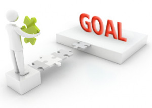 Graphic Showing A Person With Puzzle Piece Facing Goal Sign picture