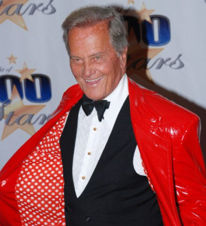 can't speak as to why he may be wearing a polka-dotted red pleather ...