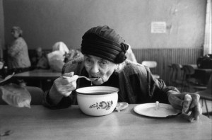 Old Woman at a Soup Kitchen