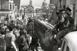 Mounted policemen watch a protest march in San Francisco on April 15 ...