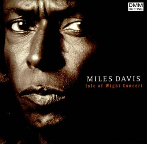 Who photographed Miles Davis' Isle of Wight Concert album cover?