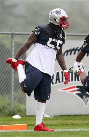 New England Patriots linebacker Brandon Spikes stretches during ...