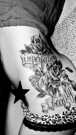 See more Imperfection is beauty and rose tattoo on side body