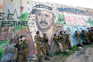 Yasser_Arafat_graffiti_West_Bank_wall_shutterstock.jpg