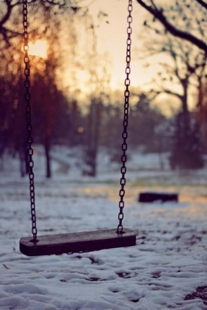 empty swing, setting sun, snow