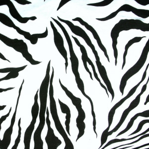 Black zebra stripes printed onto white cotton jersey knit fabric.