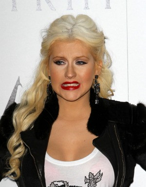 Could Christina Aguilera be hiding a pregnancy? The singer's larger ...