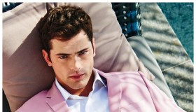 Embracing the season, Sean O'Pry lounges outdoors in spring hued suit.