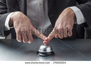business man pressing bell with insistence - stock photo