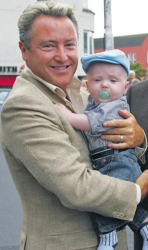 Flatley with his infant son - Google Images