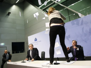 ECB president Mario Draghi gets glitter-bombed by protester at press ...