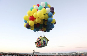 Taking off: A cluster-balloonist has launched a house into the sky ...