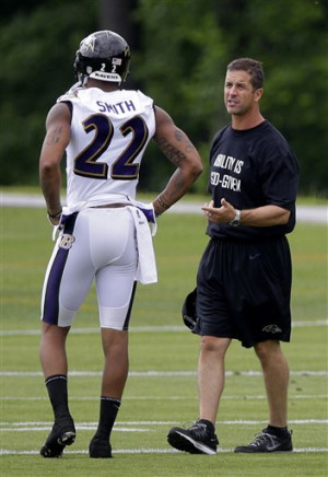 Baltimore Ravens head coach John Harbaugh, right, chats with