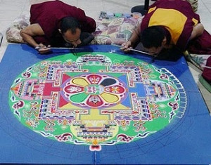 tibetan monks creating a sand mandala